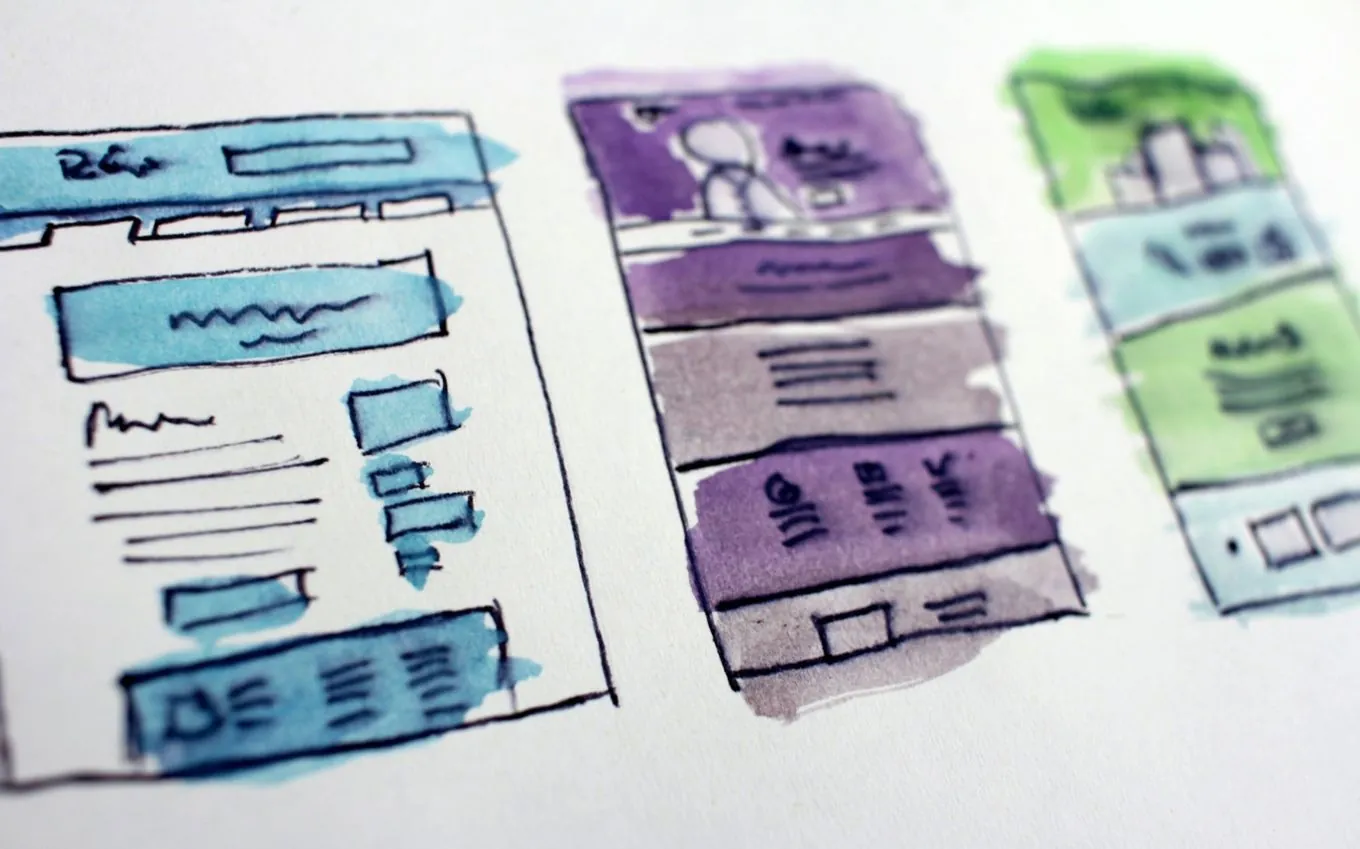 Watercolour sketches of three website layouts